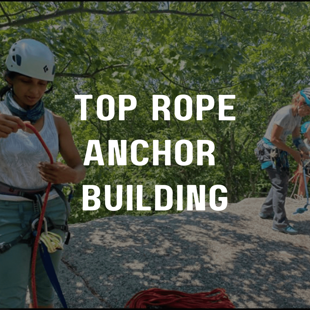 A woman is holding onto ropes while another person holds on to the rope.